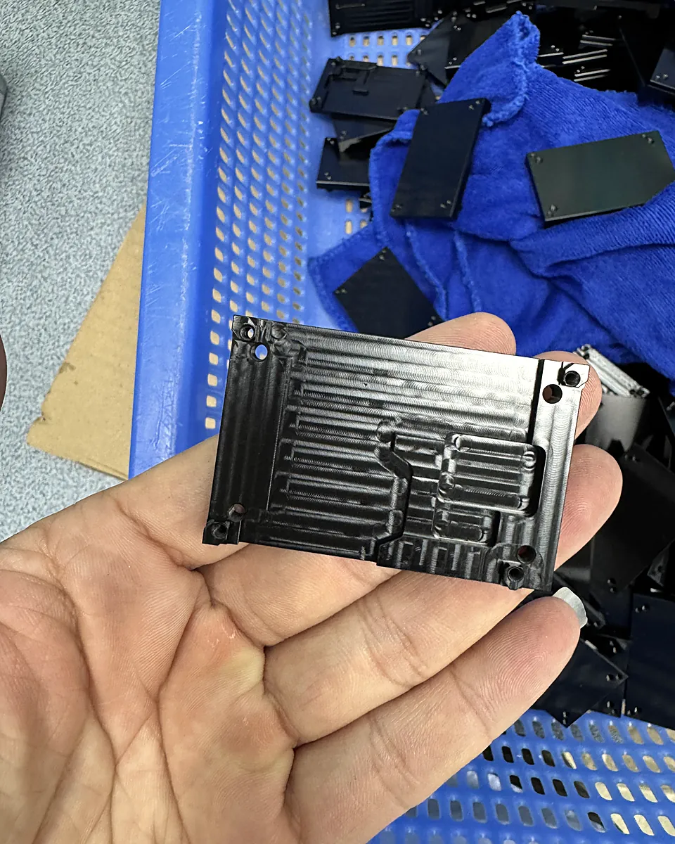 Black anodized aluminum part