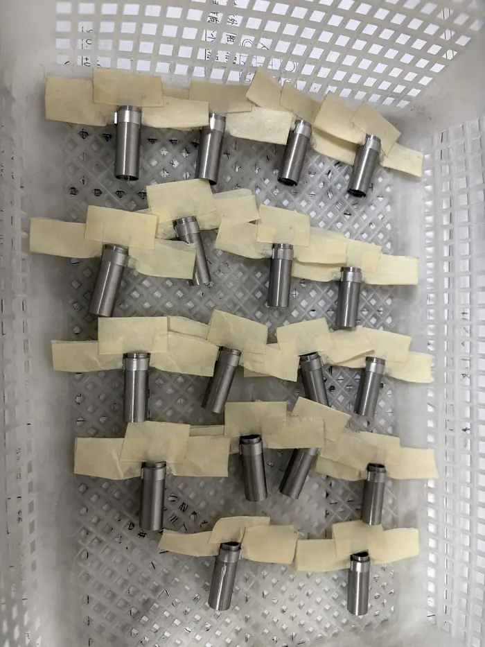 Batch of SUS430 motor housings laid out and taped one by one