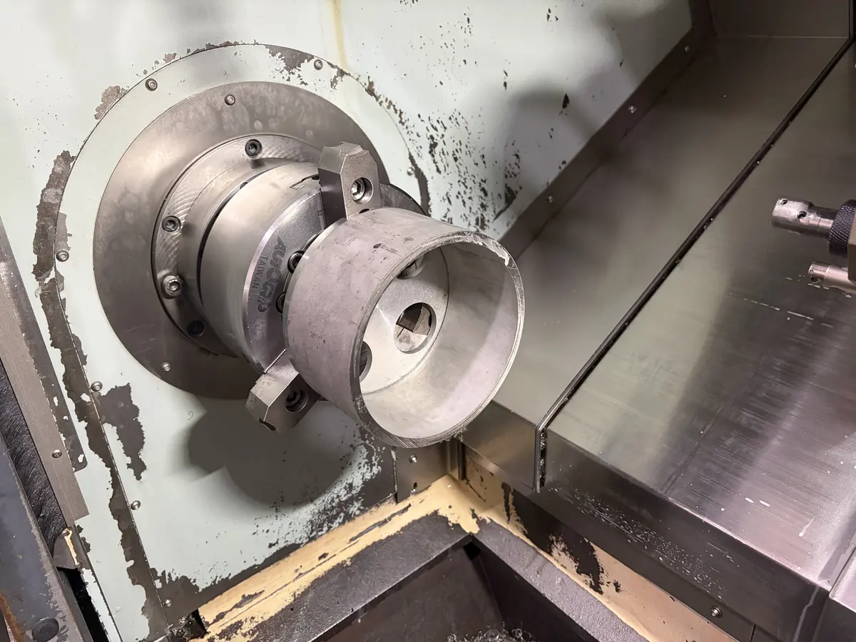 Thin-wall ring held in a dedicated fixture on the lathe spindle