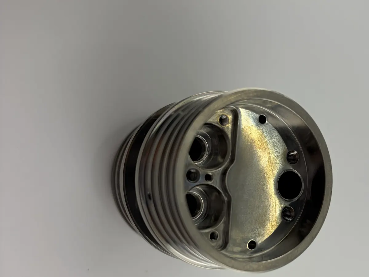 Finished TC4 titanium prototype with internal pockets, bores, and small holes