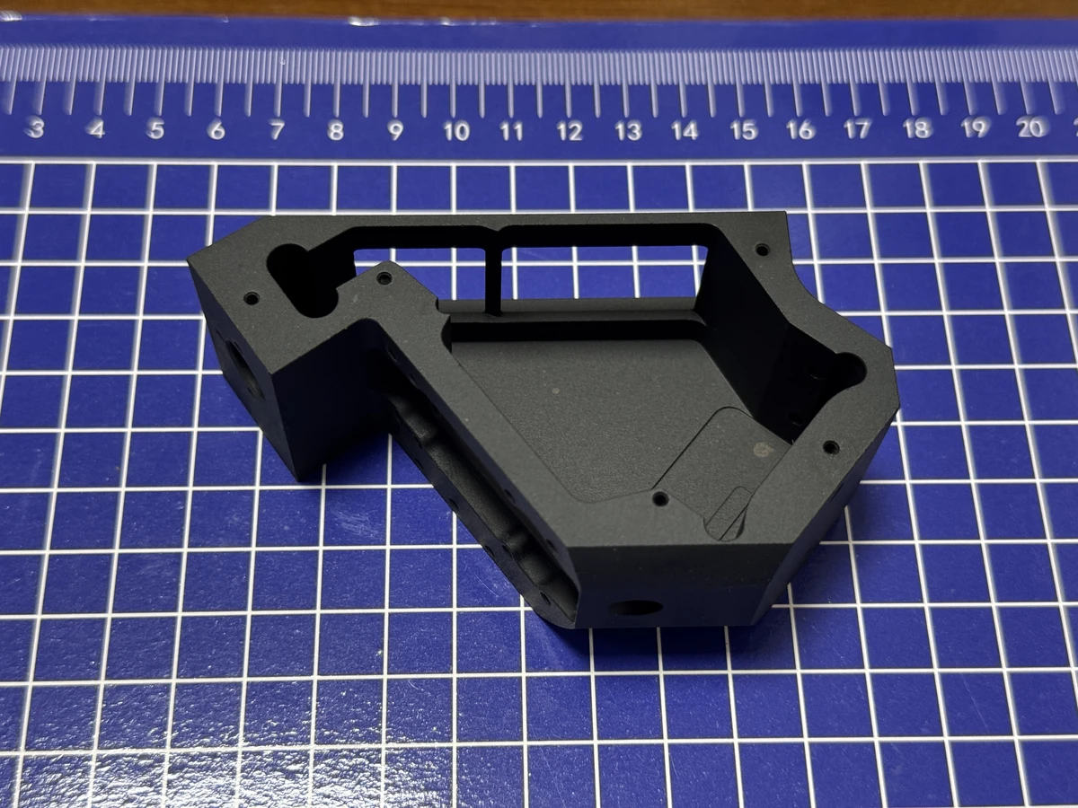 Black anodized multi-face CNC milled housing suitable for 3+2 positioning