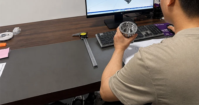 Reviewing a CAD drawing before machining at Meili Machining