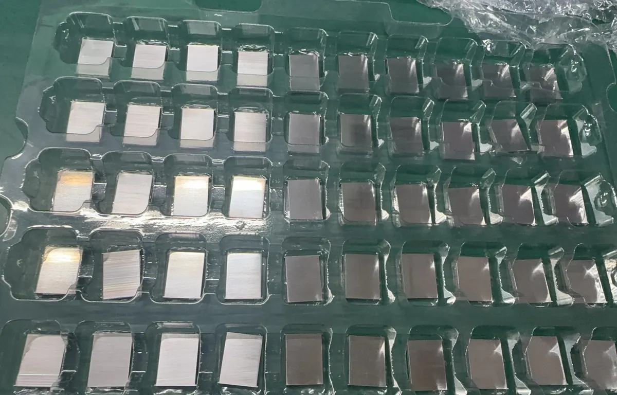 Small machined parts packed one per pocket in a clear blister tray