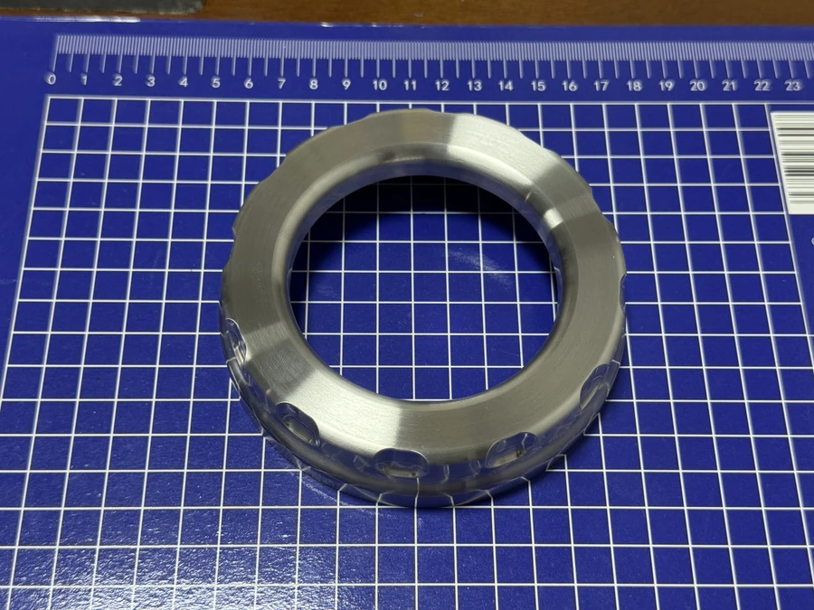 Machined stainless steel ring on a measurement mat