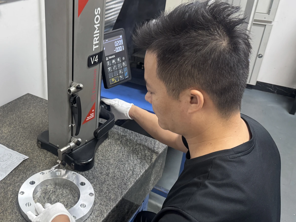 Dimensional check of CNC part with gauge