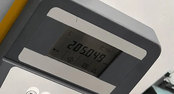 Digital height gauge readout during dimensional inspection at Meili Machining