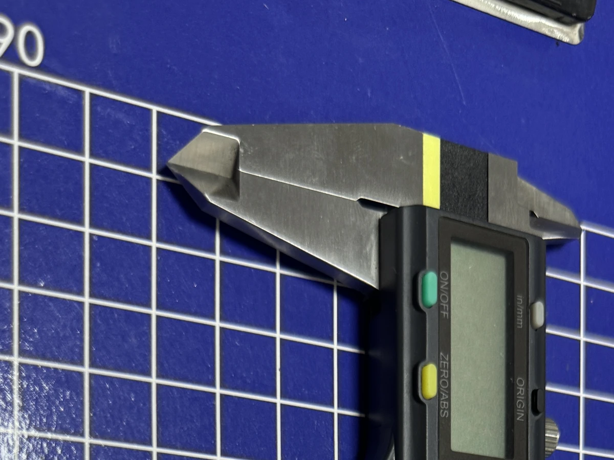 Caliper measuring machined part